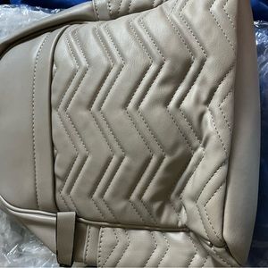 Brand New with tags grey leather back pack with tags